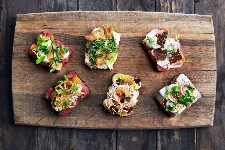 a bunch of food sitting on top of a wooden table