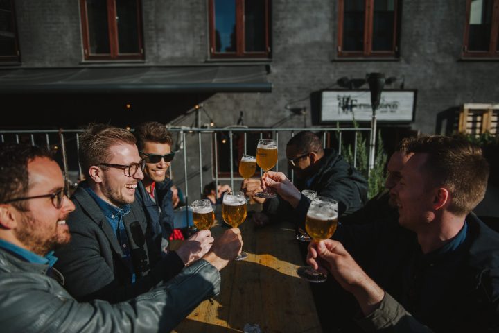 a group of people holding wine glasses